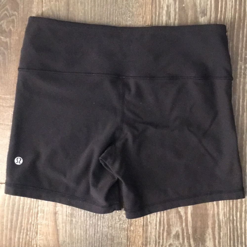 Lululemon workout shorts with pink accents